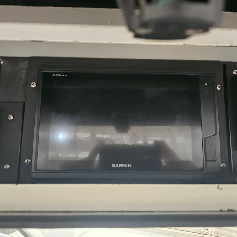 Slide: The Image of Garmin GPS display on 1994 Blackfin 33 Combi boat dashboard. - 13