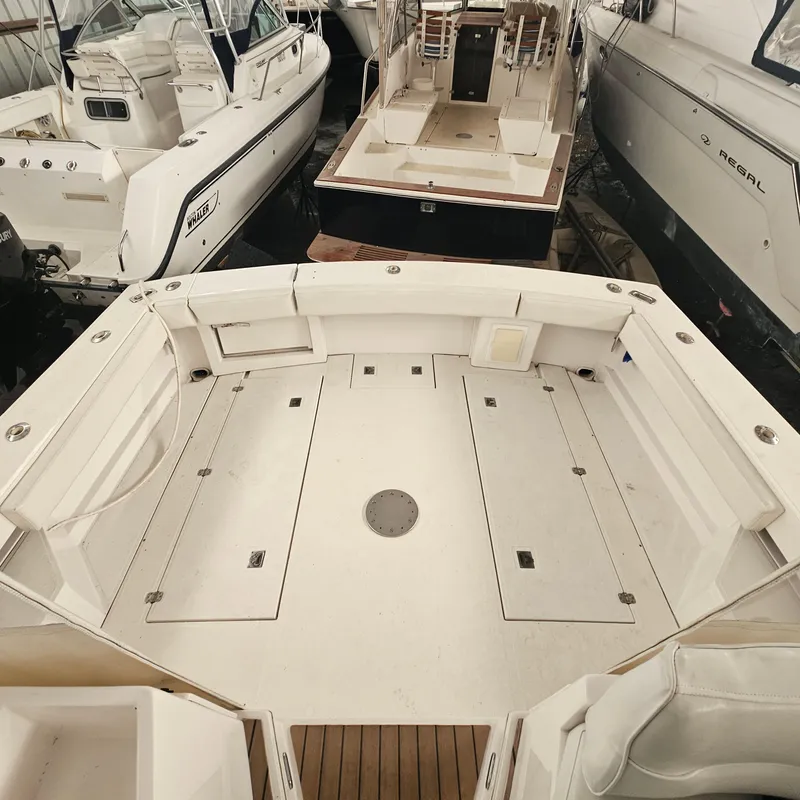 Slide: The Image of 1994 Blackfin 33 Combi boat interior with spacious deck and seating area. - 17