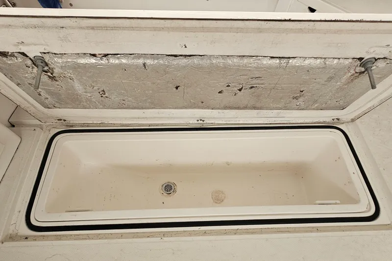 Slide: The Image of Open storage compartment on a 1994 Blackfin 33 Combi boat. - 19