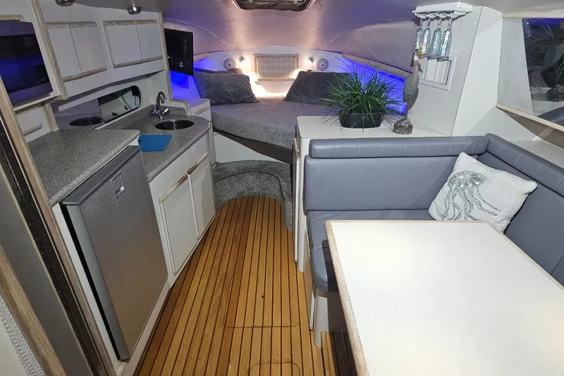 Slide: The Image of Interior of 1994 Blackfin 33 Combi boat with kitchenette, seating, and bed. - 25