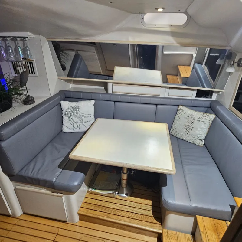 Slide: The Image of Interior of 1994 Blackfin 33 Combi with cozy seating and table. - 26