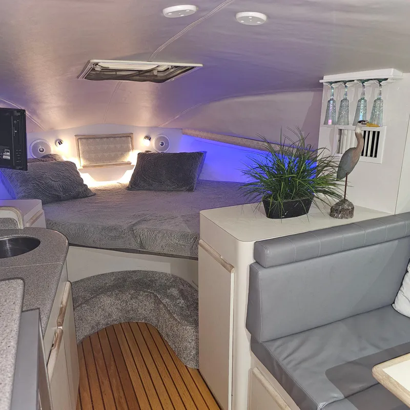 Slide: The Image of Interior of a 1994 Blackfin 33 Combi boat with cozy sleeping area and modern decor. - 29