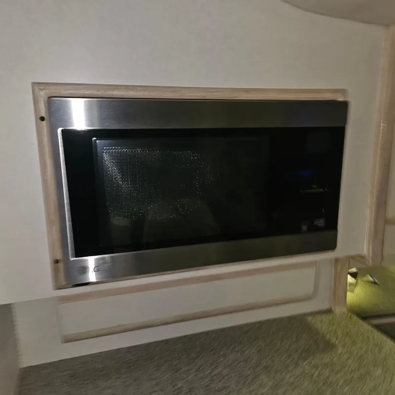 Slide: The Image of Built-in microwave in 1994 Blackfin 33 Combi boat interior. - 30