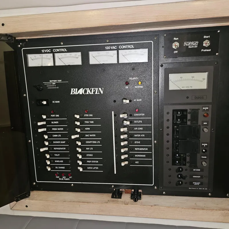 Slide: The Image of Electrical control panel of a 1994 Blackfin 33 Combi boat, featuring various switches and meters. - 36