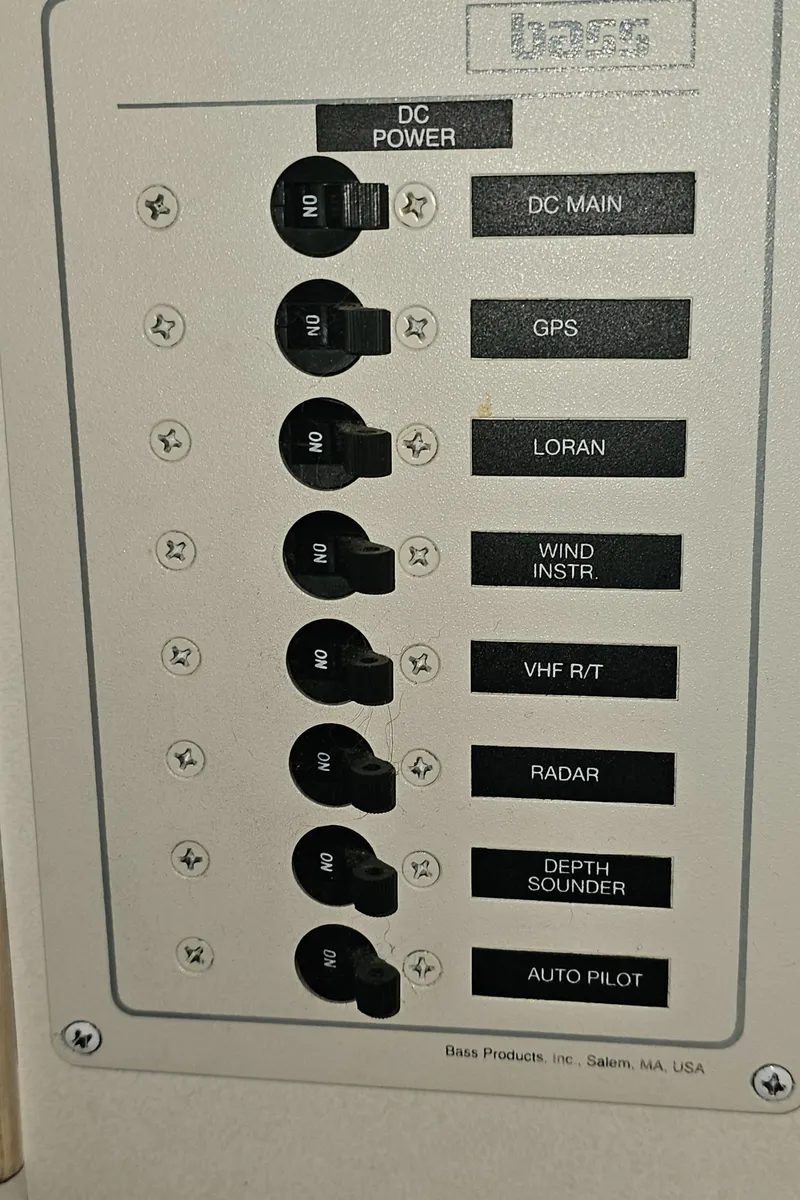Slide: The Image of 1994 Blackfin 33 Combi control panel with switches for DC power, GPS, radar, and more. - 37