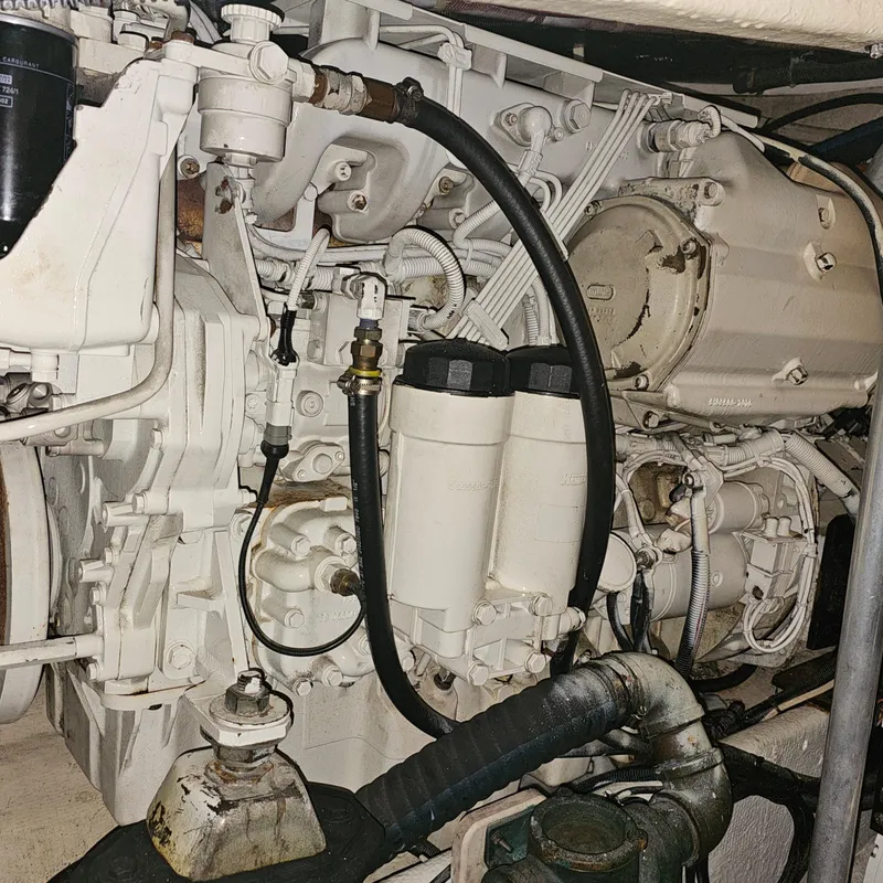 Slide: The Image of Engine compartment of a 1994 Blackfin 33 Combi boat, showcasing mechanical components. - 42