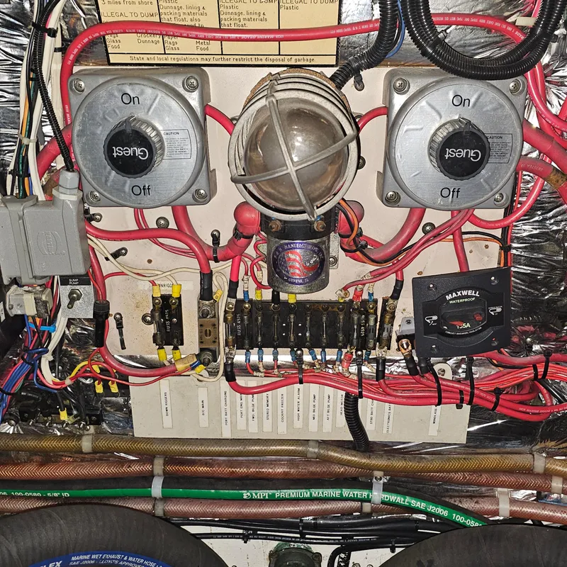 Slide: The Image of Electrical panel of a 1994 Blackfin 33 Combi boat with wiring and switches. - 44