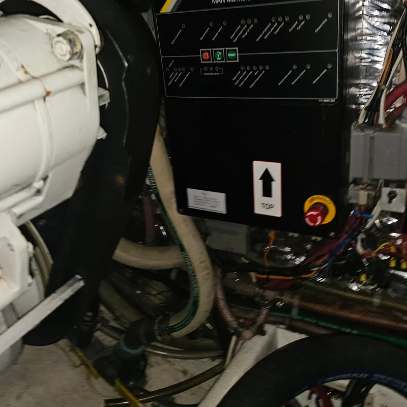 Slide: The Image of Engine room of a 1994 Blackfin 33 Combi boat, showing control panel and machinery. - 45