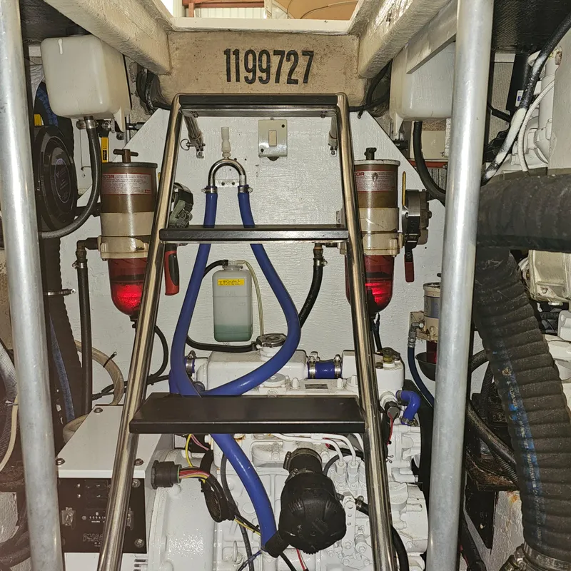 Slide: The Image of Engine room of a 1994 Blackfin 33 Combi boat, featuring mechanical components and wiring. - 46