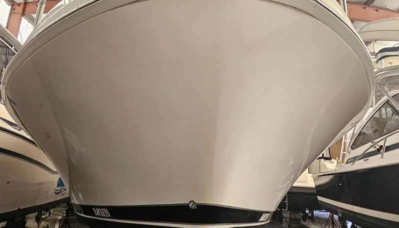 Slide: The Image of Front view of a 1994 Blackfin 33 Combi boat in storage. - 49