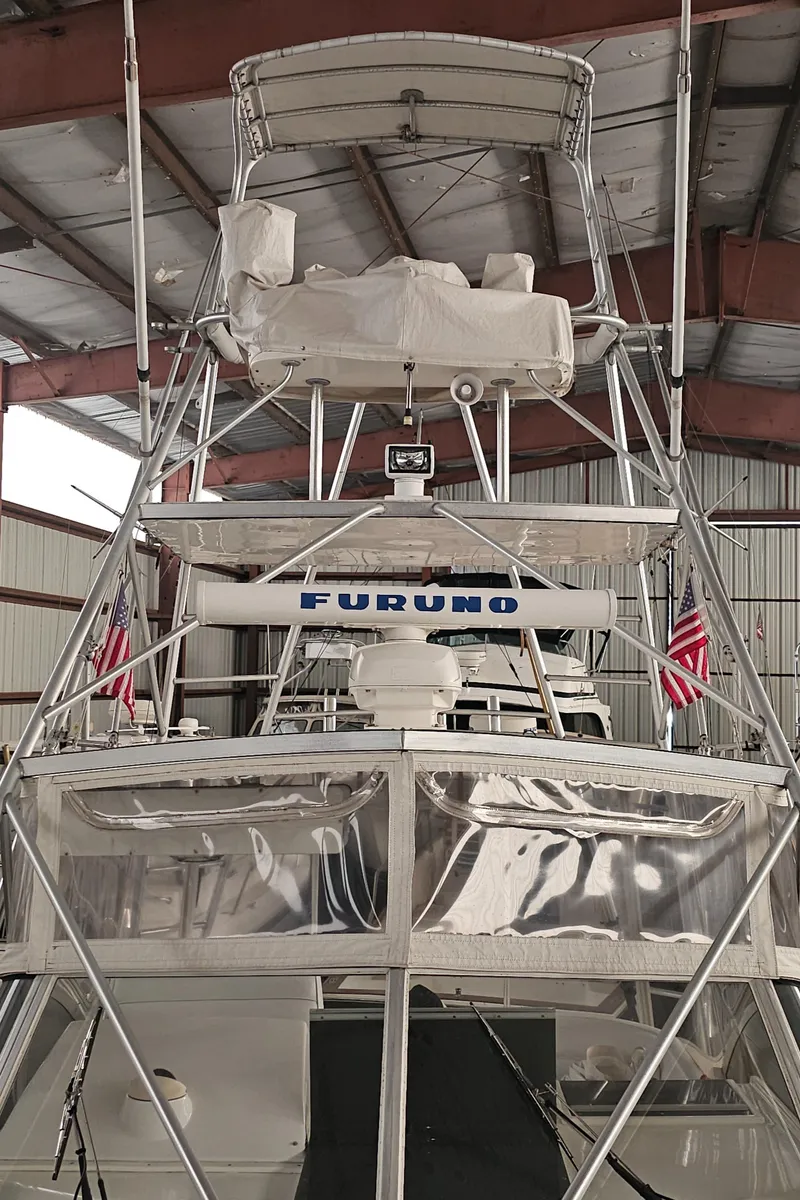 Slide: The Image of 1994 Blackfin 33 Combi boat with tower and Furuno equipment in a storage facility. - 7