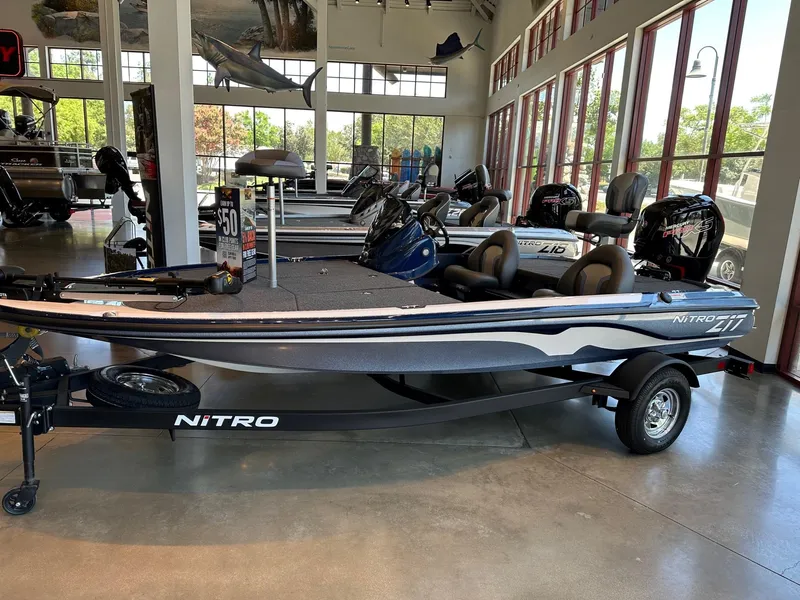Slide: The Image of 2025 Nitro Z17 boat displayed in a showroom with sleek design and modern features. - 0