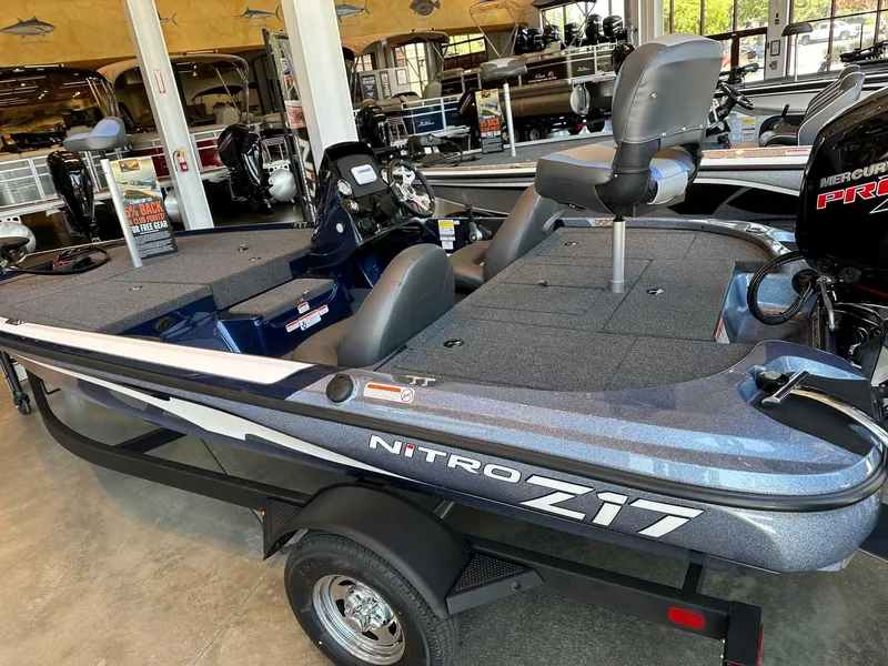 Slide: The Image of 2025 Nitro Z17 boat in showroom, featuring sleek design and modern seating. - 2