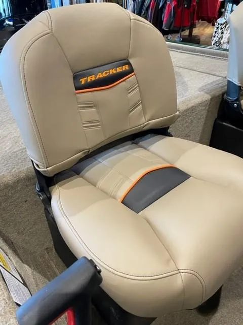 Slide: The Image of 2025 Tracker Bass Tracker Classic Limited boat seat with beige upholstery and orange accents. - 45