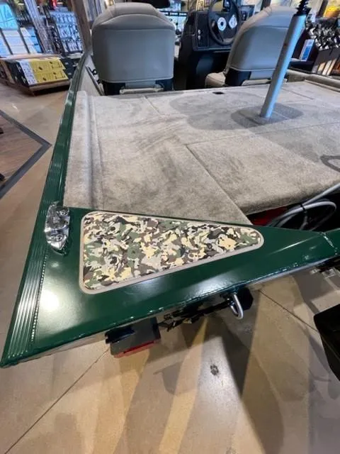 Slide: The Image of 2025 Tracker Bass Tracker Classic Limited boat interior with camouflage detail and seating. - 48