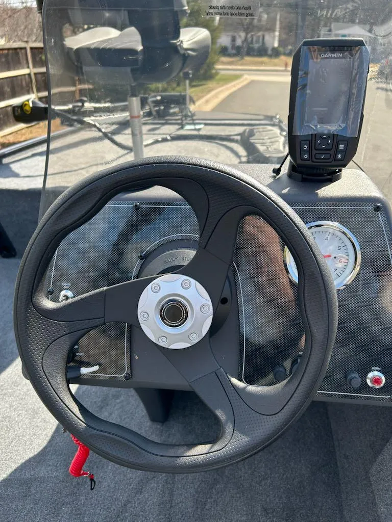 Slide: The Image of Steering wheel and dashboard of 2025 Tracker Bass Tracker Classic XL boat. - 7