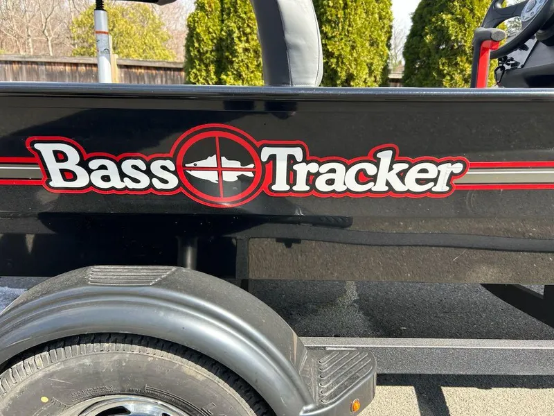 Slide: The Image of 2025 Tracker Bass Tracker Classic XL logo on black boat trailer. - 8