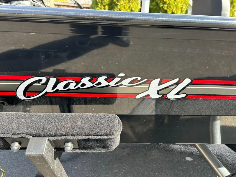 Slide: The Image of 2025 Tracker Bass Tracker Classic XL boat logo with red and black accents. - 9