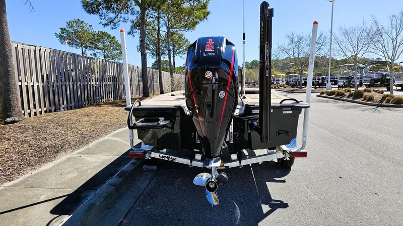 Slide: The Image of 2025 Mako 18 Pro Skiff Backwater Edition boat on trailer, rear view. - 13