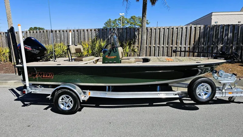 Slide: The Image of 2025 Mako 18 Pro Skiff Backwater Edition on trailer, parked outdoors. - 15