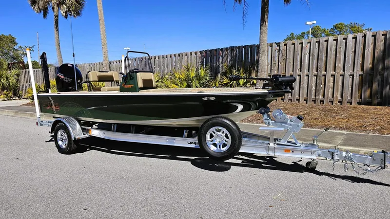 Slide: The Image of 2025 Mako 18 Pro Skiff Backwater Edition on trailer, parked outdoors. - 3