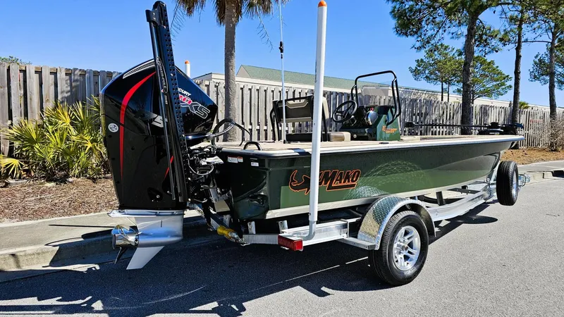 Slide: The Image of 2025 Mako 18 Pro Skiff Backwater Edition on trailer, parked outdoors. - 4