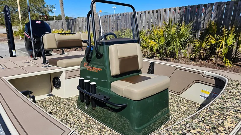 Slide: The Image of 2025 Mako 18 Pro Skiff Backwater Edition boat with seating and rod holders. - 6