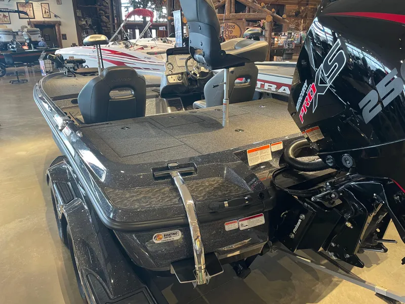 Slide: The Image of 2025 Nitro Z21 XL boat with powerful engine, displayed indoors. - 2