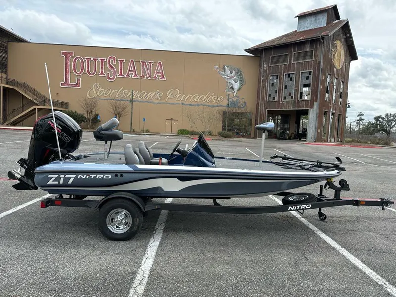 Slide: The Image of 2025 Nitro Z17 boat parked in front of Louisiana Sportsman's Paradise building. - 2