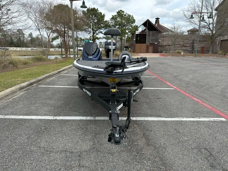 Slide: The Image of 2025 Nitro Z17 boat parked in an outdoor lot, front view. - 3