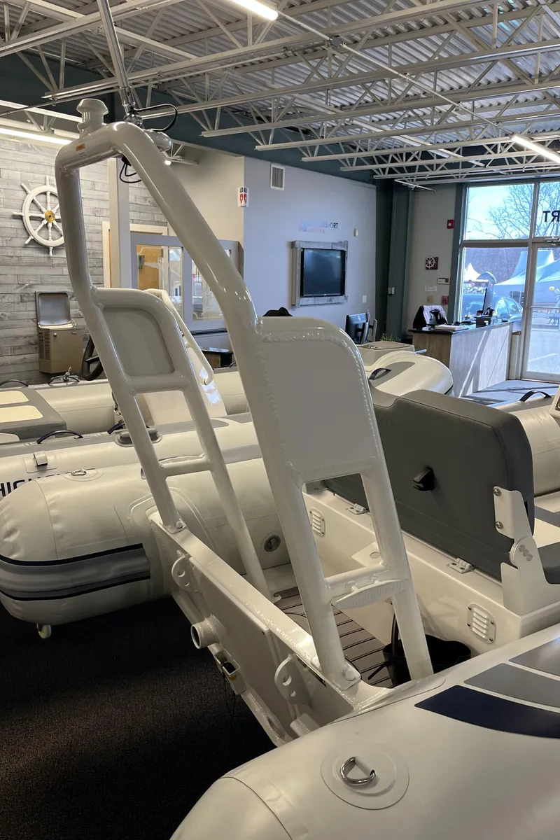 Slide: The Image of 2025 Highfield Classic 400 inflatable boat in showroom, featuring sleek design and modern interior. - 2