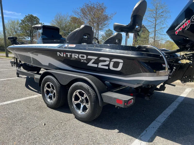 Slide: The Image of 2025 Nitro Z20 XL Pro boat on trailer in parking lot. - 2
