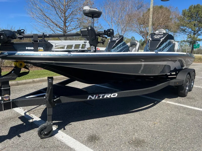 Slide: The Image of 2025 Nitro Z20 XL Pro fishing boat on trailer in parking lot. - 3