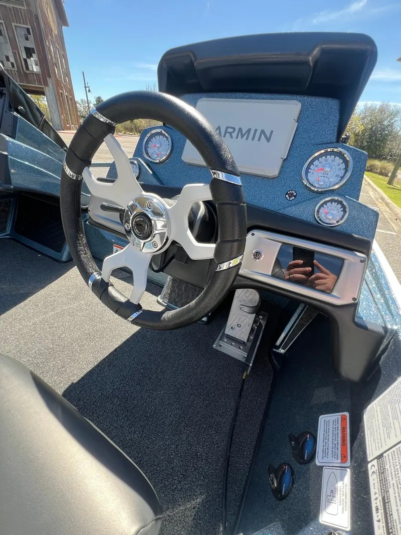 Slide: The Image of 2025 Nitro Z20 XL Pro boat dashboard with Garmin display and steering wheel. - 9