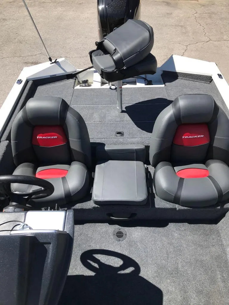 Slide: The Image of 2025 Tracker Pro Team 175 boat interior with two black and red seats. - 5