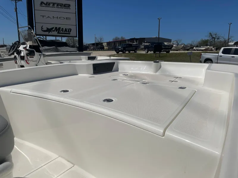 Slide: The Image of 2025 Mako Pro Skiff 15 CC boat deck under clear blue sky. - 6