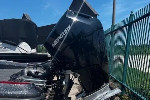 Slide: The Image of Outboard motor on a 2025 Nitro ZV21 Pro boat, parked near a fence. - 3