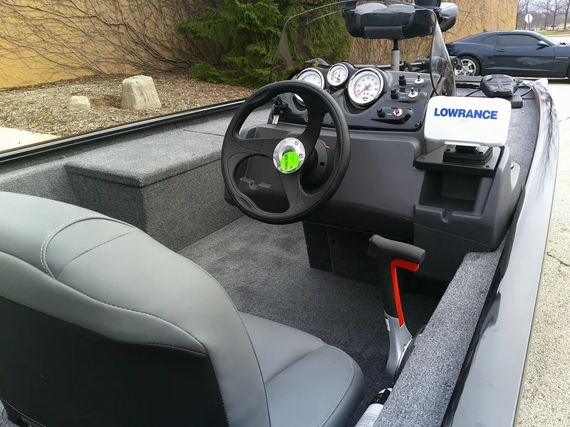 Slide: The Image of 2025 Tracker Pro 170 boat interior with steering wheel and Lowrance electronics. - 4