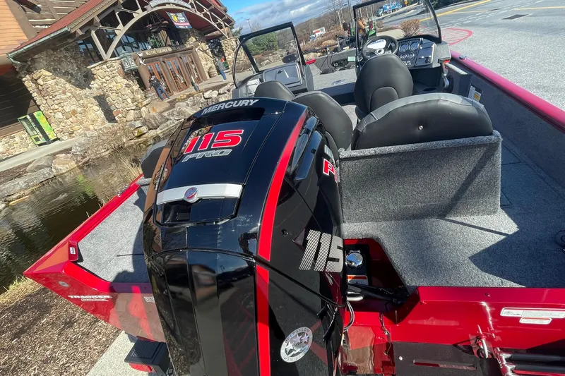 Slide: The Image of 2025 Tracker Pro Guide V-175 Combo boat with Mercury 115 engine, parked outdoors. - 3