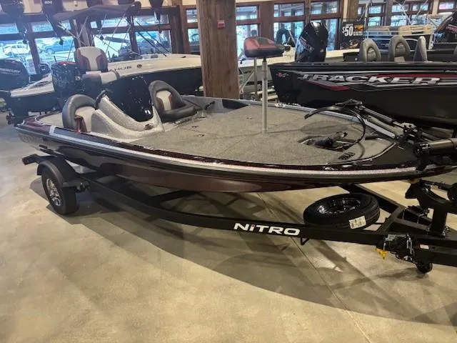 Slide: The Image of 2025 Nitro Z17 boat on display in showroom, featuring sleek design and modern features. - 2