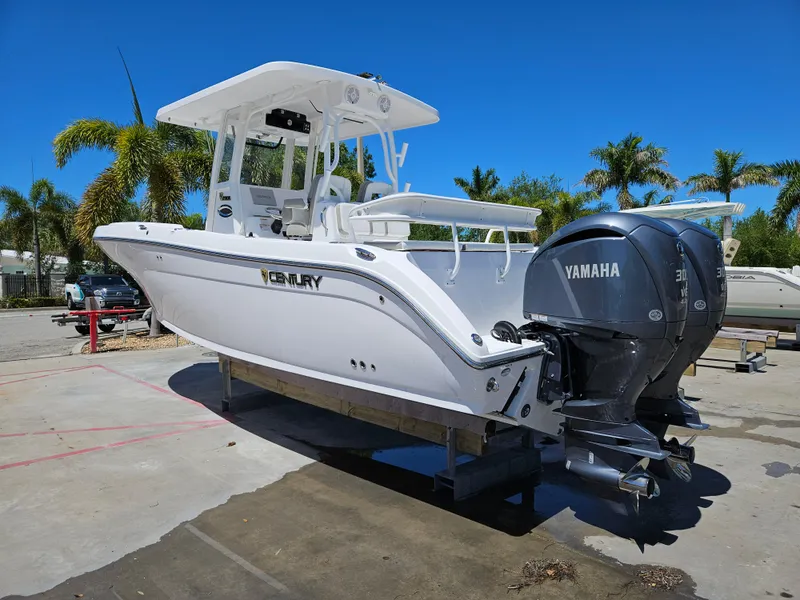 The Image of 2022 Century 2900 Center Console boat with Yamaha engines, parked outdoors. - 0