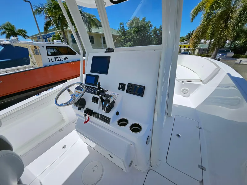 Slide: The Image of 2022 Century 2900 Center Console boat interior with modern dashboard and steering wheel. - 13