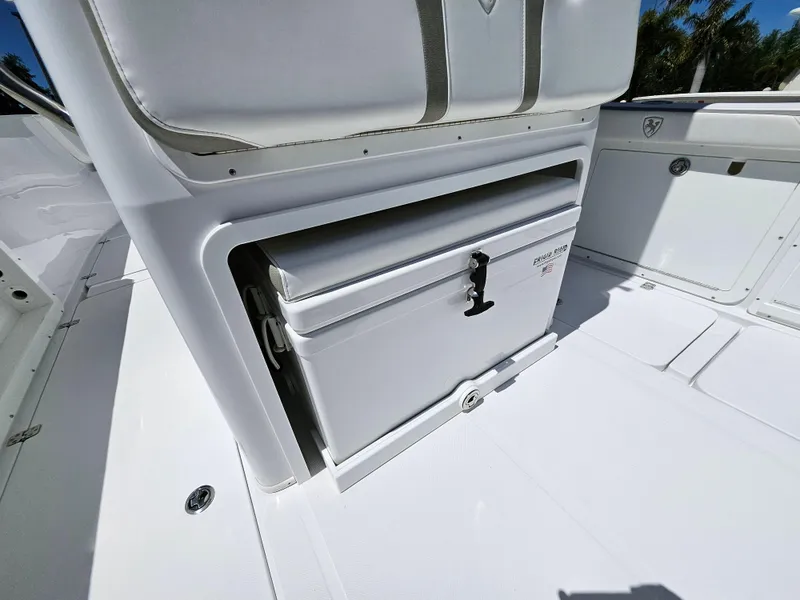Slide: The Image of Century 2900 Center Console 2022 boat interior with storage compartment. - 19