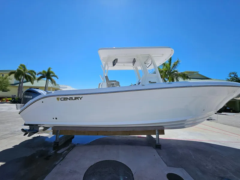 Slide: The Image of 2022 Century 2900 Center Console boat on display under clear blue sky. - 2
