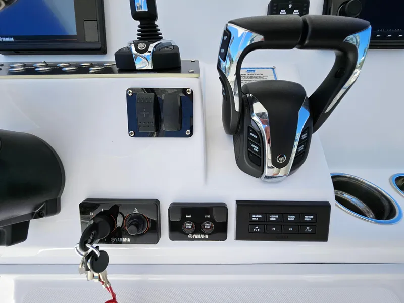Slide: The Image of Century 2900 Center Console 2022 boat controls with Yamaha throttle and switches. - 27