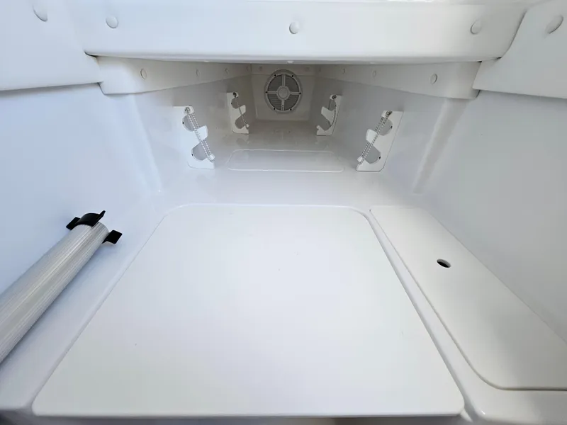Slide: The Image of Interior view of 2022 Century 2900 Center Console boat storage compartment. - 28