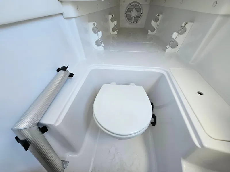Slide: The Image of 2022 Century 2900 Center Console boat interior with compact marine toilet. - 29