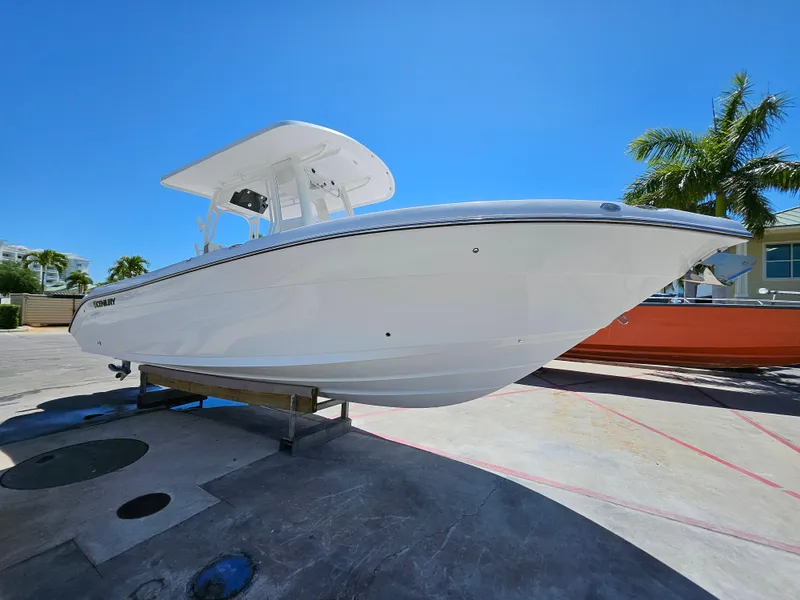 Slide: The Image of 2022 Century 2900 Center Console boat on display under clear blue sky. - 3