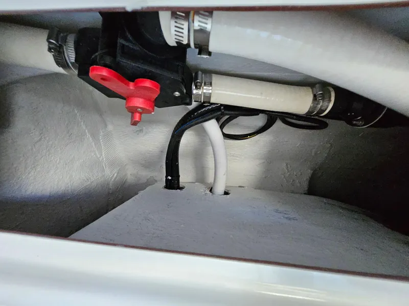 Slide: The Image of Interior view of 2022 Century 2900 Center Console boat plumbing system. - 30