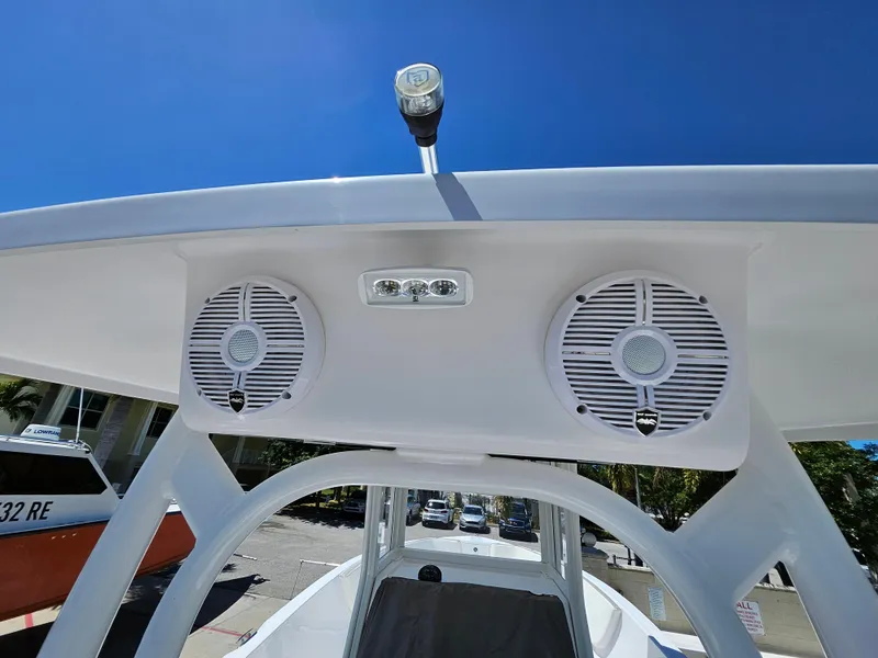 Slide: The Image of Century 2900 Center Console 2022 boat speakers and light under clear blue sky. - 39